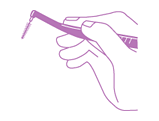 Hold the interdental brush like a pencil.